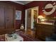 Elegant living room with hardwood floors, a decorative mirror, and a classic display case at 2445 N Delaware St, Indianapolis, IN 46205