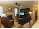 Comfortable living area with a fireplace, built-in shelving, and a view from kitchen counter seating at 2445 N Delaware St, Indianapolis, IN 46205