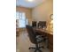 Office space features a wooden desk, computer, and plenty of storage at 2445 N Delaware St, Indianapolis, IN 46205