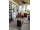 Cozy sunroom with ceiling fan, outdoor view and seating at 2445 N Delaware St, Indianapolis, IN 46205