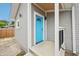 Back porch with a turquoise door and gray siding at 301 Leeds Ave, Indianapolis, IN 46201