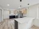 Modern kitchen boasts stainless steel appliances, two-tone cabinetry, and quartz countertops at 301 Leeds Ave, Indianapolis, IN 46201