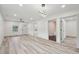 Open-concept living space with modern lighting and access to various rooms in the home at 301 Leeds Ave, Indianapolis, IN 46201
