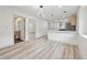 Open-concept living area featuring updated finishes and modern fixtures, connecting to a bathroom at 301 Leeds Ave, Indianapolis, IN 46201