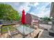 Outside deck with table, chairs, and umbrella perfect for entertaining in backyard at 3360 Main St, Plainfield, IN 46168