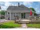 This home has a back deck with table, chairs, and an umbrella at 3360 Main St, Plainfield, IN 46168
