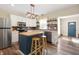 Well-lit kitchen featuring a center island, stainless steel appliances, and butcher block countertop at 3360 Main St, Plainfield, IN 46168