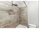 Bathroom shower and tub combination features gray wooden paneling at 3409 S Rural St, Indianapolis, IN 46237