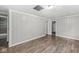 Spacious bedroom featuring stylish wood-look floors and neutral wall color at 3409 S Rural St, Indianapolis, IN 46237