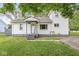 Charming home featuring a well-maintained front yard and a welcoming entrance at 3409 S Rural St, Indianapolis, IN 46237