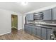 Efficient kitchen featuring plentiful cabinetry and durable wood-look floors at 3409 S Rural St, Indianapolis, IN 46237