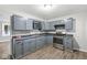 Well-lit kitchen featuring ample cabinet space and stainless steel appliances at 3409 S Rural St, Indianapolis, IN 46237