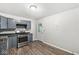 Functional kitchen featuring stainless steel appliances and wood-look flooring at 3409 S Rural St, Indianapolis, IN 46237