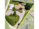 Aerial view of the property outlining the in-ground pool, detached garage, and wooded surround at 3480 W Broadus Dr, North Vernon, IN 47265
