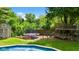Large backyard with in-ground pool, playground set, trampoline, and shed at 3480 W Broadus Dr, North Vernon, IN 47265