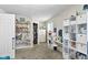 A bedroom with built in wall shelves and a closet offers plenty of storage space at 3480 W Broadus Dr, North Vernon, IN 47265