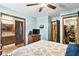 A bedroom showcases an open en-suite bathroom and walk-in closet, enhancing its appeal at 3480 W Broadus Dr, North Vernon, IN 47265