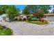 Charming ranch home with detached garage, stone facade, and colorful landscaping at 3480 W Broadus Dr, North Vernon, IN 47265