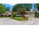 Charming ranch home with attached garage, stone facade, and colorful landscaping at 3480 W Broadus Dr, North Vernon, IN 47265