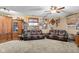 Cozy game room with leather seating, built-in shelving, and carpet flooring at 3480 W Broadus Dr, North Vernon, IN 47265