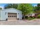 Well maintained garage with ample parking space and a charming house with beautiful landscaping at 3480 W Broadus Dr, North Vernon, IN 47265