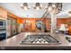 Kitchen with a cooktop island overlooking the dining area and unique rustic design at 3480 W Broadus Dr, North Vernon, IN 47265