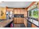 Bright kitchen with stainless steel appliances, light wood cabinets, and natural light at 3480 W Broadus Dr, North Vernon, IN 47265