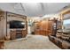 Comfortable living room featuring a fireplace, entertainment center, and leather seating at 3480 W Broadus Dr, North Vernon, IN 47265