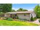 Well-maintained ranch home with covered patio, yard, and manicured landscaping at 3480 W Broadus Dr, North Vernon, IN 47265