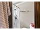 This white shower has neutral walls and bronze fixtures, creating a clean, modern look at 3480 W Broadus Dr, North Vernon, IN 47265