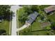 Aerial view of a landscaped home with a driveway and garden at 377 4Th E Ct, Carmel, IN 46033