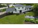 Aerial view of home featuring a large backyard, patio, garden, and surrounding trees and fencing at 377 4Th E Ct, Carmel, IN 46033