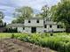 Backyard featuring a lush garden, white exterior, and patio furniture at 377 4Th E Ct, Carmel, IN 46033