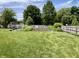 Large, well-maintained backyard with lawn and garden, enclosed by a wooden fence for privacy at 377 4Th E Ct, Carmel, IN 46033