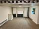 Spacious basement with neutral carpet, modern cabinets, and ample open space for various activities at 377 4Th E Ct, Carmel, IN 46033