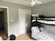 Bedroom featuring a bunk bed, closet, and gray walls at 377 4Th E Ct, Carmel, IN 46033