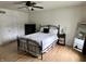 Inviting bedroom features wood floors, ceiling fan, and a window offering ample natural light at 377 4Th E Ct, Carmel, IN 46033