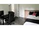 Bedroom featuring modern decor, a black desk, and a comfortable bed, creating an inviting and functional space at 377 4Th E Ct, Carmel, IN 46033