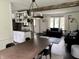 Dining room with table, view of the kitchen, and living room at 377 4Th E Ct, Carmel, IN 46033