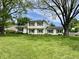 Charming two-story home with lush green lawn and classic curb appeal and dark shutters at 377 4Th E Ct, Carmel, IN 46033