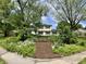 Charming two-story home with mature landscaping and a bench at 377 4Th E Ct, Carmel, IN 46033