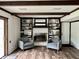 Bright living room with hardwood floors, exposed beams, and fireplace with built-ins at 377 4Th E Ct, Carmel, IN 46033