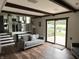 Bright living room with hardwood floors and sliding doors to the outdoors at 377 4Th E Ct, Carmel, IN 46033