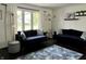 Comfortable living room with matching sofas, hardwood floors and natural light at 377 4Th E Ct, Carmel, IN 46033