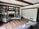 Bright living room with hardwood floors, exposed beams, and fireplace with built-ins at 377 4Th E Ct, Carmel, IN 46033