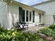 Outdoor patio with table and chairs, beautiful landscaping and brick exterior at 377 4Th E Ct, Carmel, IN 46033