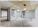 Spacious basement offers built-in shelving, drop ceiling tiles and an adjacent room at 3841 S Sherman Dr, Indianapolis, IN 46237