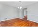 Dining room with hardwood floors and classic lighting, offering a cozy and inviting space at 3841 S Sherman Dr, Indianapolis, IN 46237