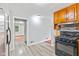 A brightly lit kitchen offers stainless steel appliances and sleek hardwood flooring at 3841 S Sherman Dr, Indianapolis, IN 46237