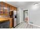 This inviting kitchen has wood countertops, stainless steel appliances, and stylish flooring at 3841 S Sherman Dr, Indianapolis, IN 46237